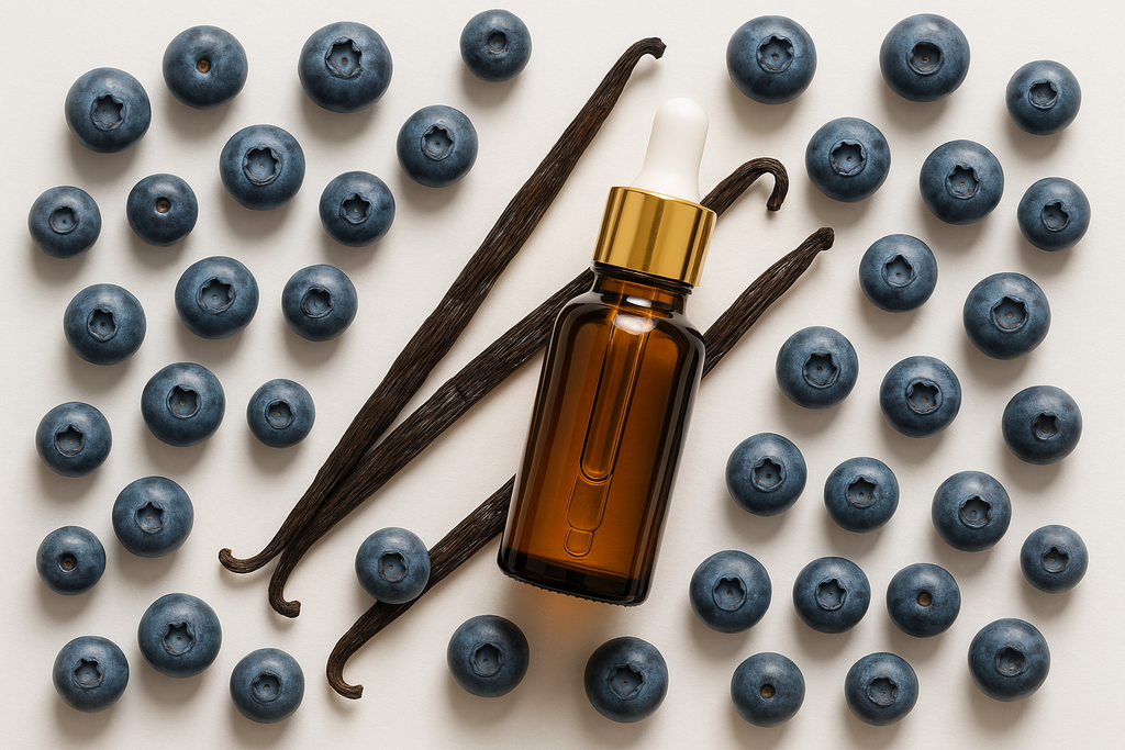 BLUEBERRIES AND VANILLA BEANS WITH AN ESSENTIAL OILS BOTTLE AND A WHITE BACKGROUND